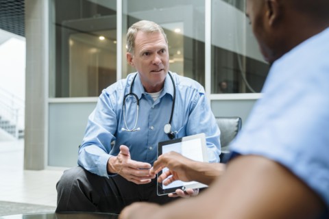 Doctor and nurse discussing digital tablet