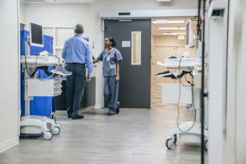 Doctor and nurse talking in hospital