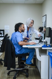 Doctor and nurse using computer