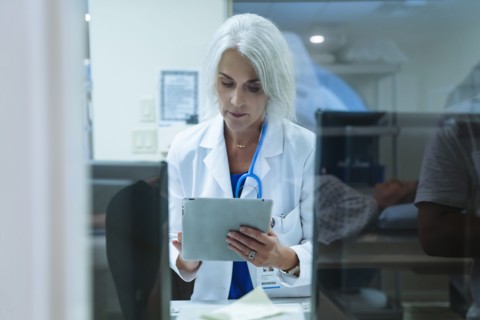 Doctor using digital tablet