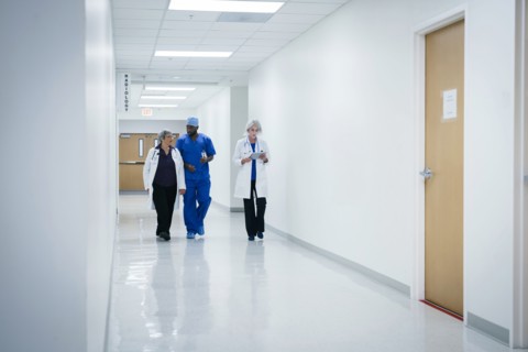 Doctors and nurse walking in hospital