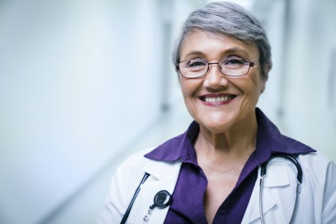 Portrait of smiling mixed race doctor