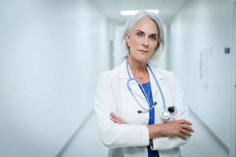 Portrait of confident Caucasian doctor in hospital
