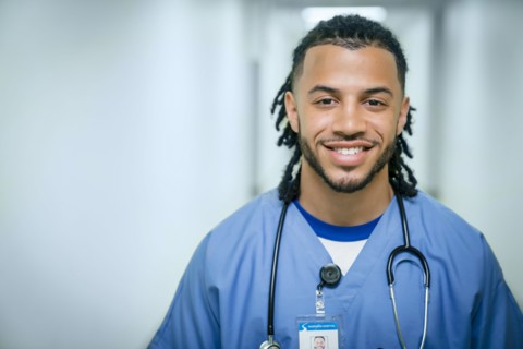 Portrait of smiling mixed race nurse