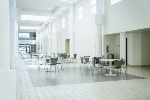 Tables and chairs in empty lobby
