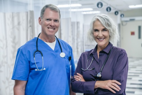 Portrait of smiling Caucasian doctors in hospital
