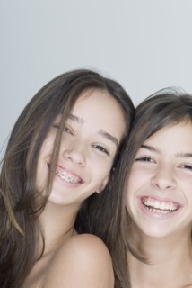 Two Hispanic teenage girls smiling