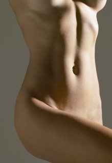 Close up of nude Hispanic woman's torso