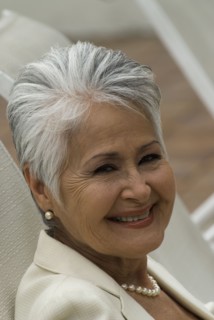Senior Hispanic woman in lounge chair