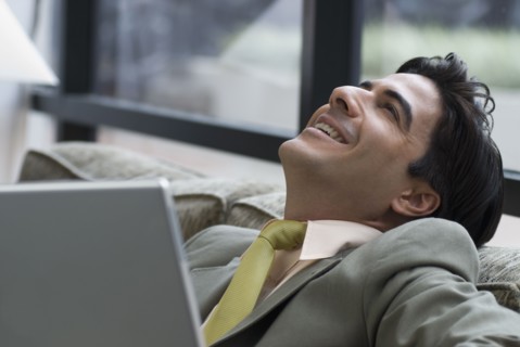 Hispanic businessman on sofa
