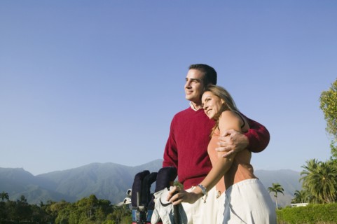 Multi-ethnic couple on golf course