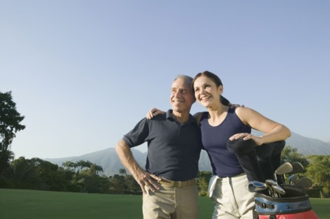 Hispanic couple on golf course