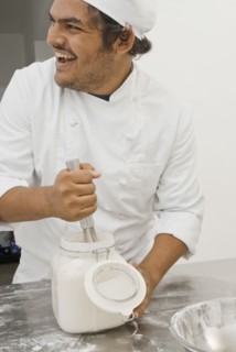 Baker working in bakery kitchen
