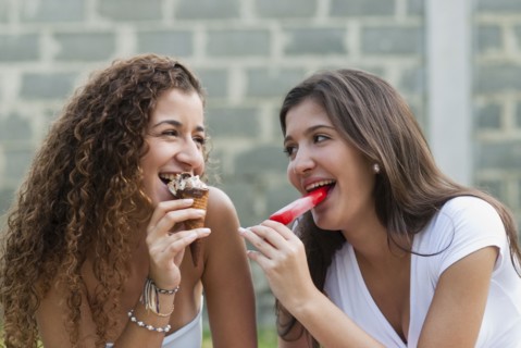 Hispanic friends eating ice cream together