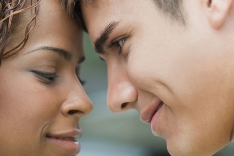 Smiling couple looking at each other