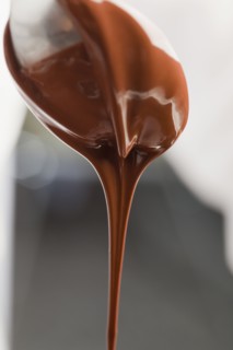 Chocolate dripping from spoon