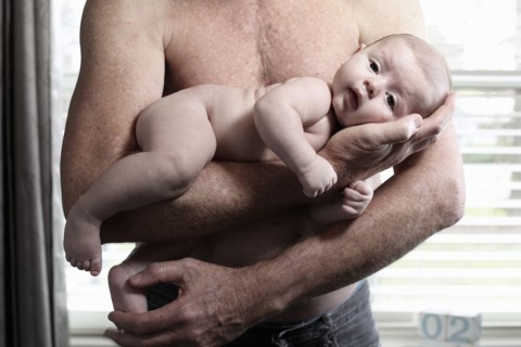 Father holding baby son