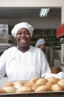 Mixed race baker working in commercial kitchen