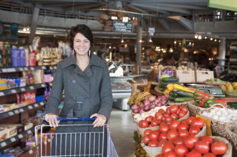 Hispanic woman shopping in grocery store