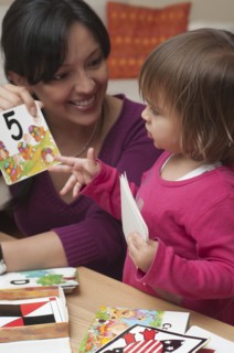 Hispanic mother teaching daughter numbers