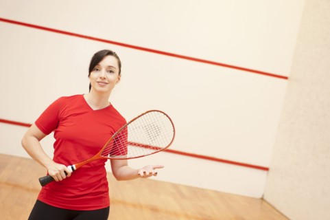 Hispanic woman playing racquetball