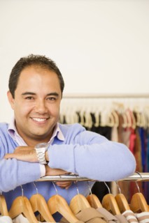 Hispanic man working in clothing store
