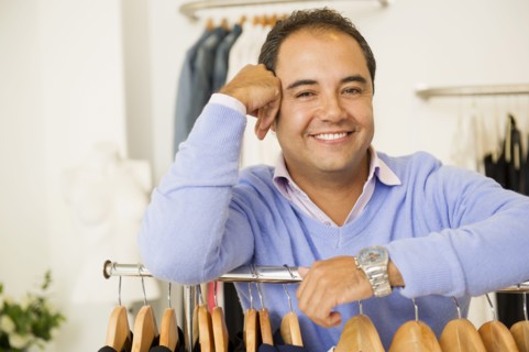 Hispanic man working in clothing store