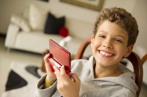 Hispanic boy playing video game