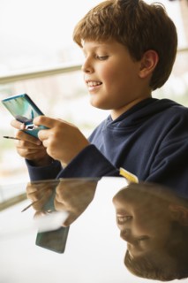 Hispanic boy playing video game