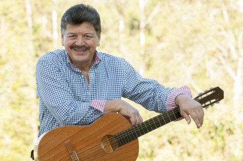 Hispanic man holding guitar