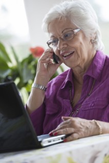 Hispanic woman using laptop