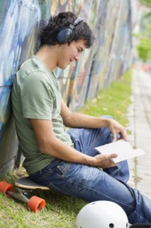 Hispanic man listening to headphones