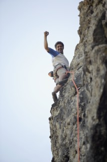 Argentinean man rock climbing