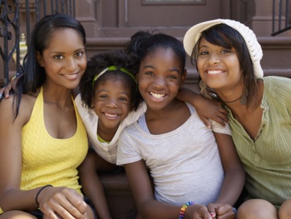 Mothers and daughters hugging