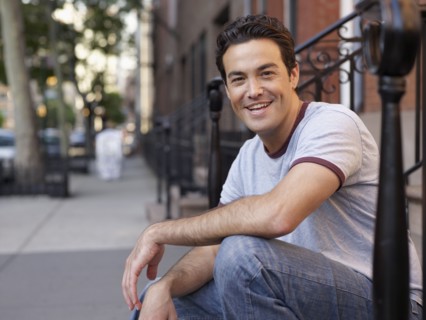 Man sitting on front stoop
