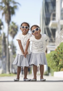 Young mixed race girls wearing sunglasses