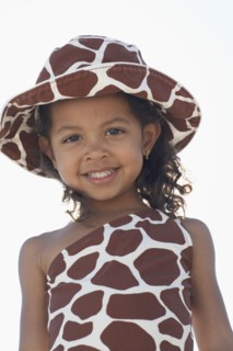 Young mixed race girl in bathing suit and hat