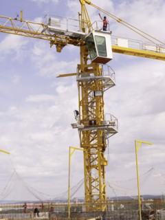 Construction worker on top of crane