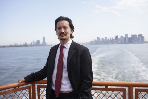 Mixed race businessman on ferry