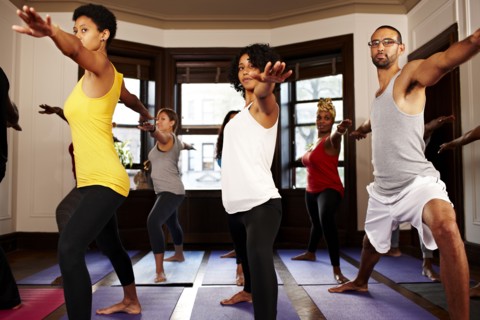 People practicing yoga in class