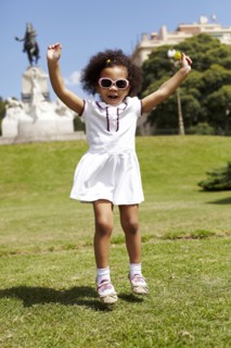Mixed race girl playing in park