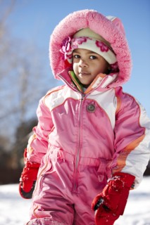 Mixed race girl wearing snowsuit
