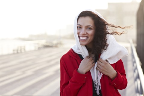 Mixed race woman walking on pier