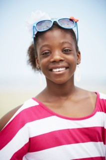 Black girl wearing novelty sunglasses outdoors
