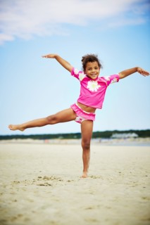 Mixed race girl posing on beach