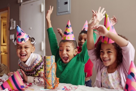 Children cheering at party