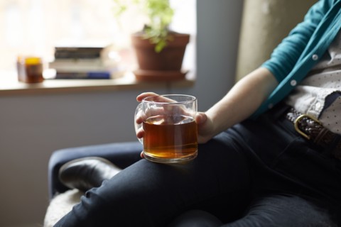 Close up of woman holding mug of tea