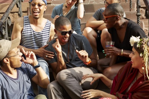 Friends relaxing on front stoop