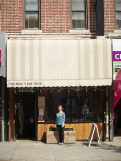 Caucasian woman standing outside store