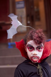 Mixed race girl wearing vampire costume